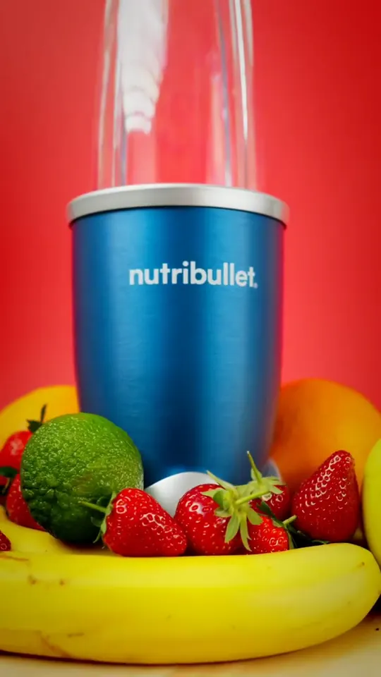 The nutribullet with fruit on red
