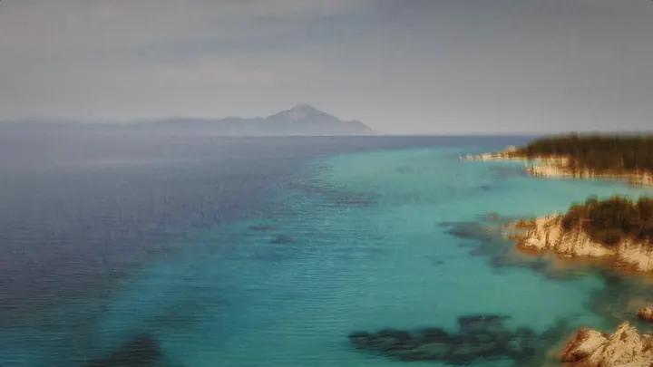 The coast with a mountain on the horizon