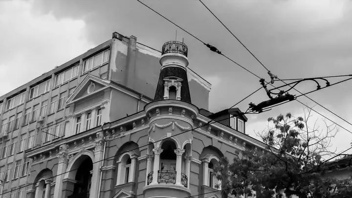 An old building with tram wires
