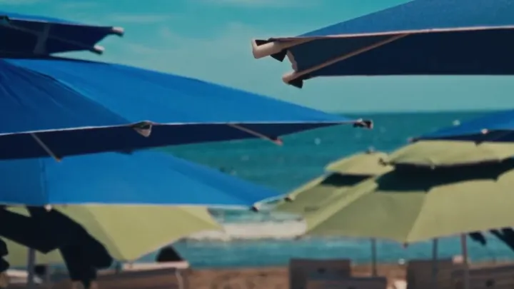 Blue and green umbrellas in a row