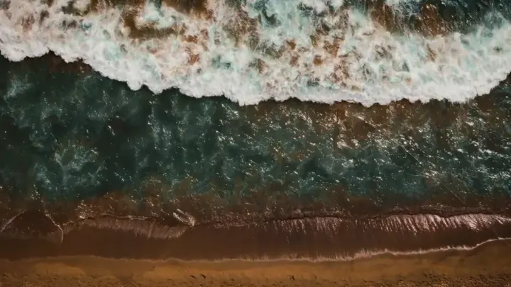 Foam on the shore from above